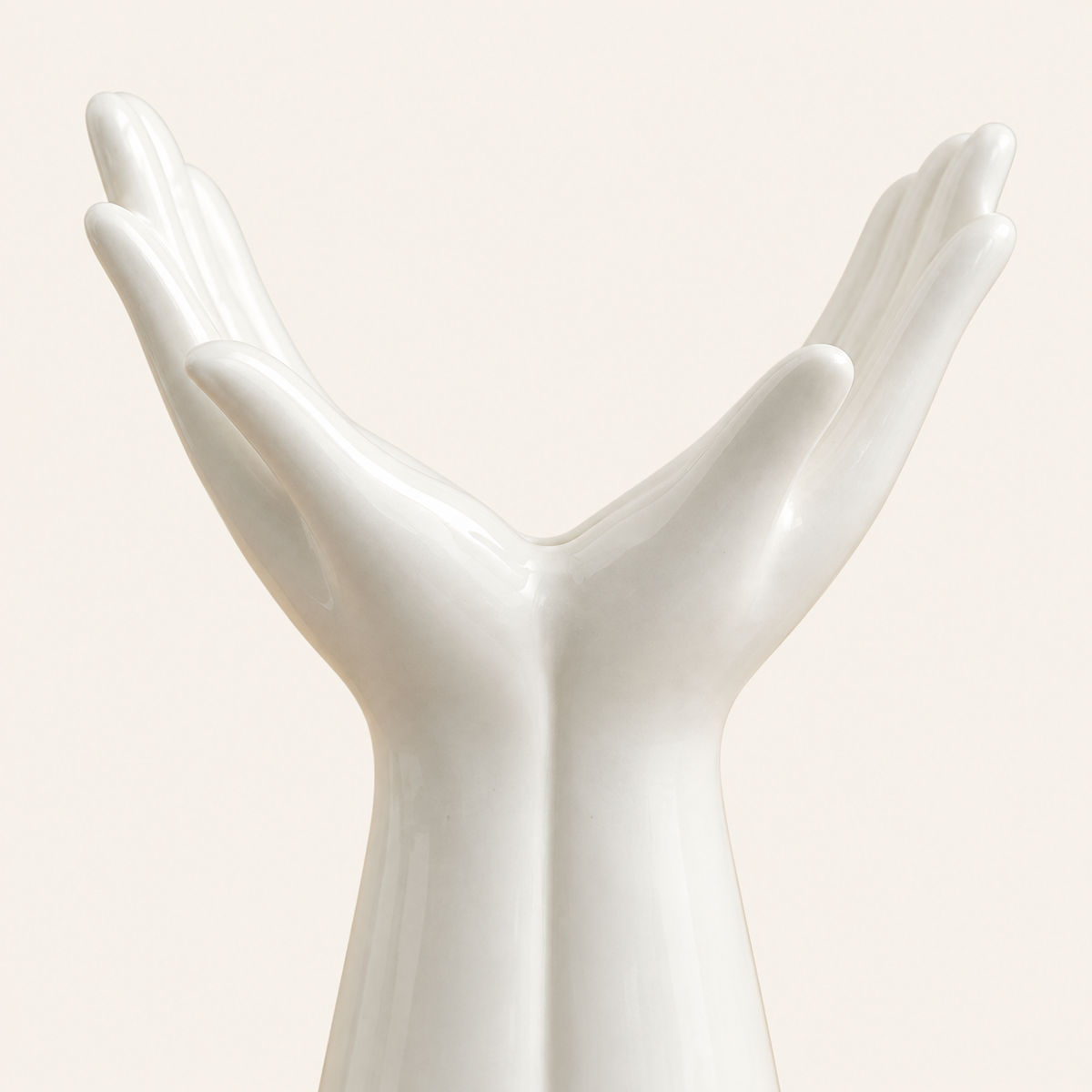 Small hand vase close detail of white glaze and palm curves