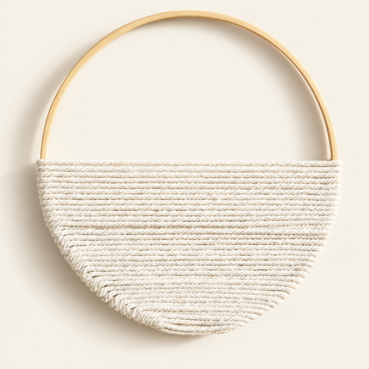 Close view of cream cord wrap rows and goldtone hoop