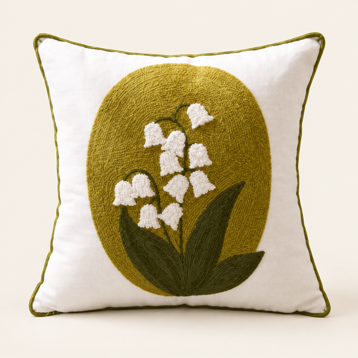 Embroidered Floral Cushion Cover — Lily of the valley on a cream studio background