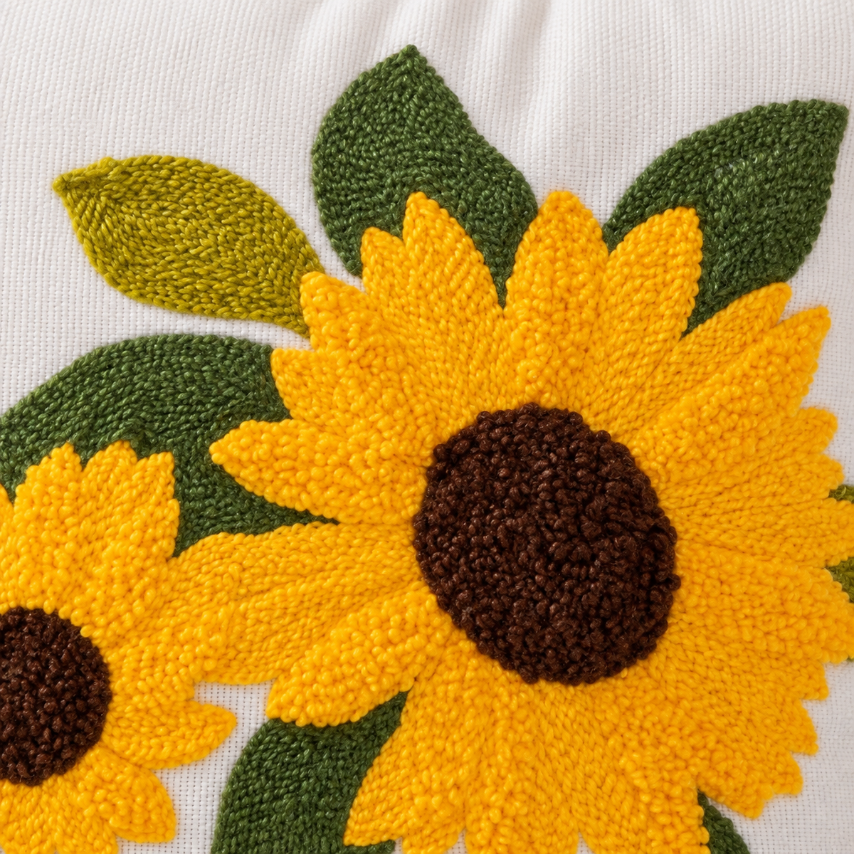 Close view of the Four Sunflowers embroidery and visible canvas texture