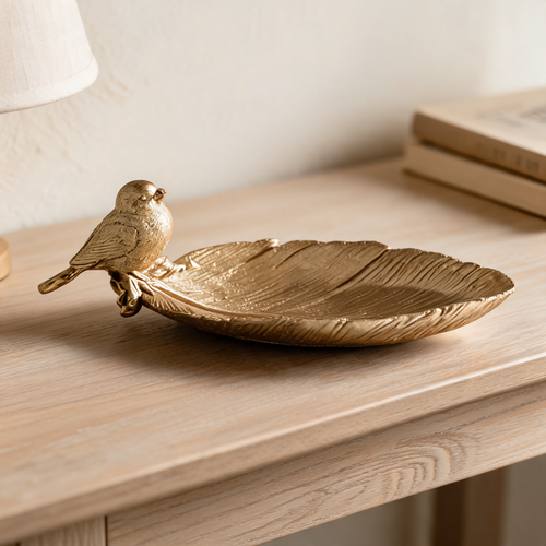 Gold Bird & Leaf Tray on a wooden bedside table