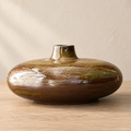 Handcrafted Zen-inspired low rounded ceramic vessel in a brown and green glaze